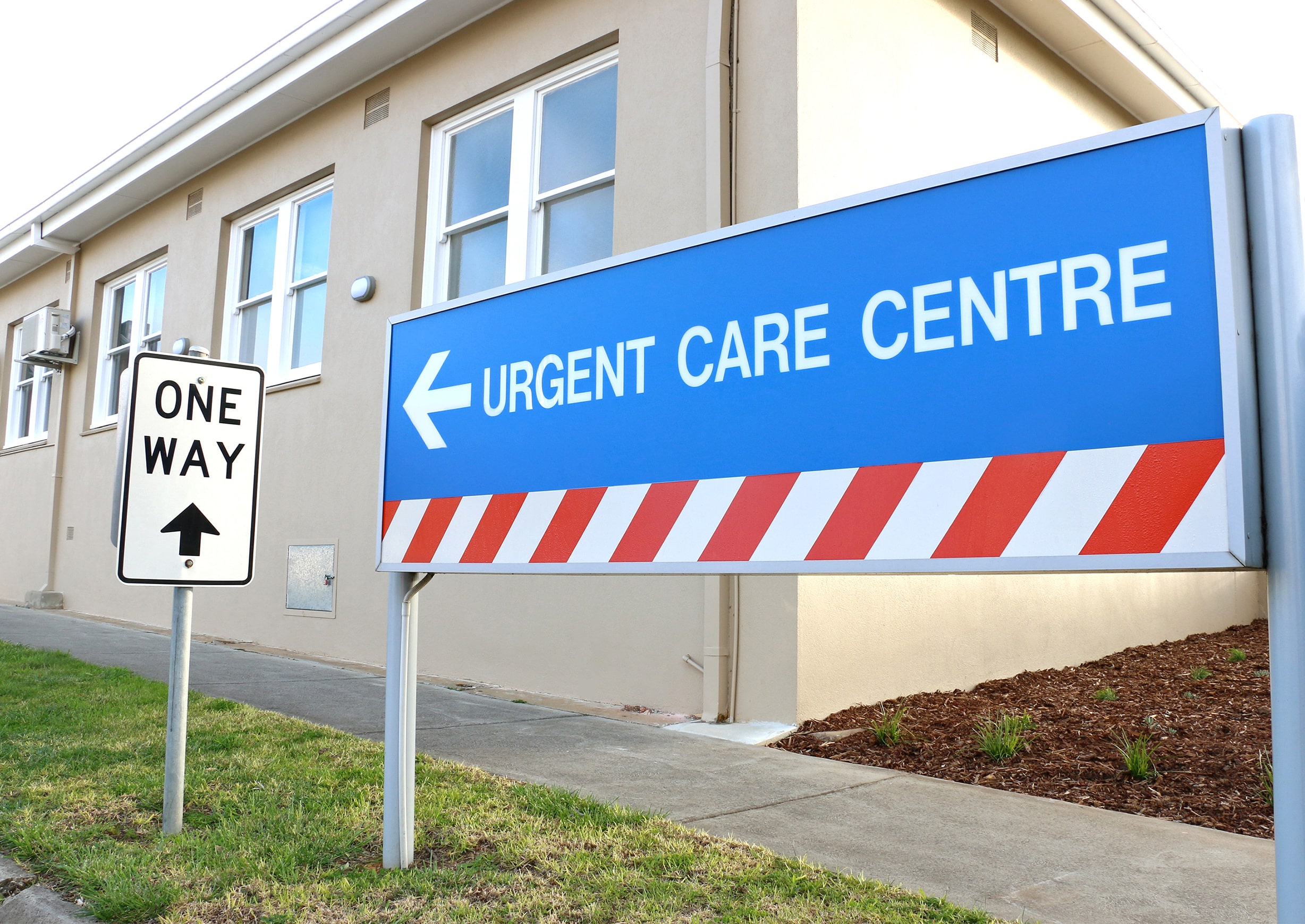 sign pointing to urgent care facility